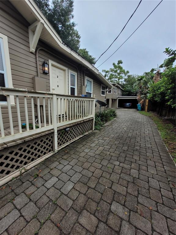 a view of a house with wooden fence