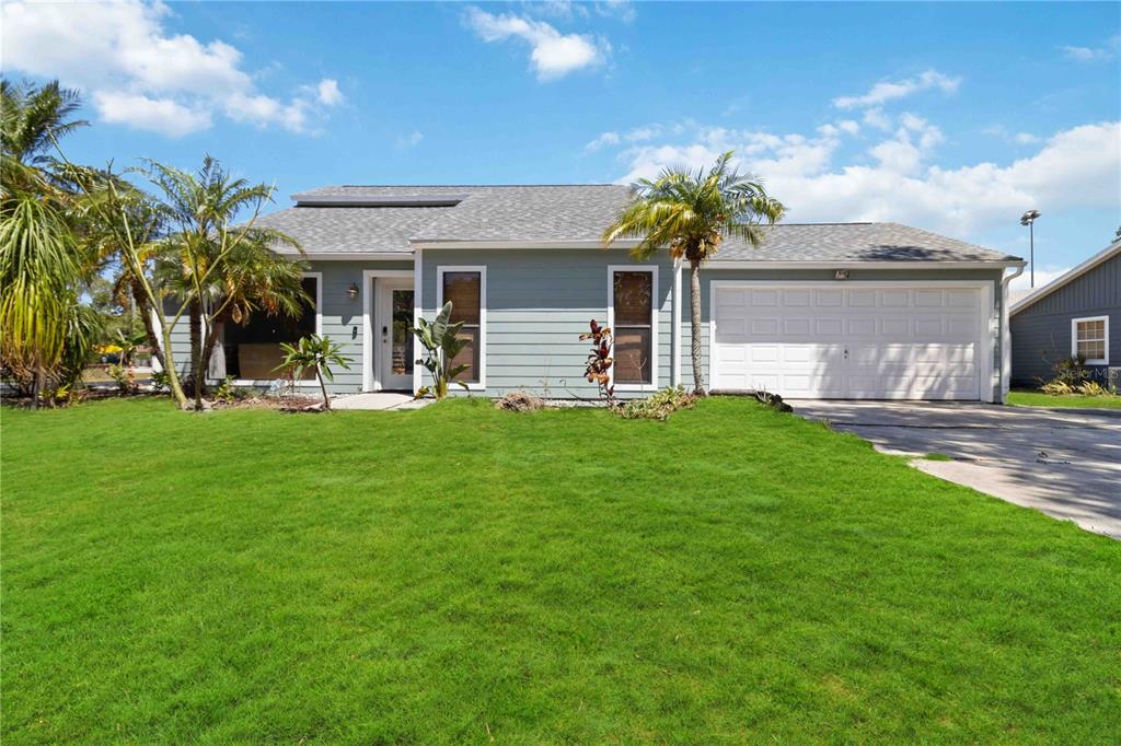 a front view of house with yard and green space