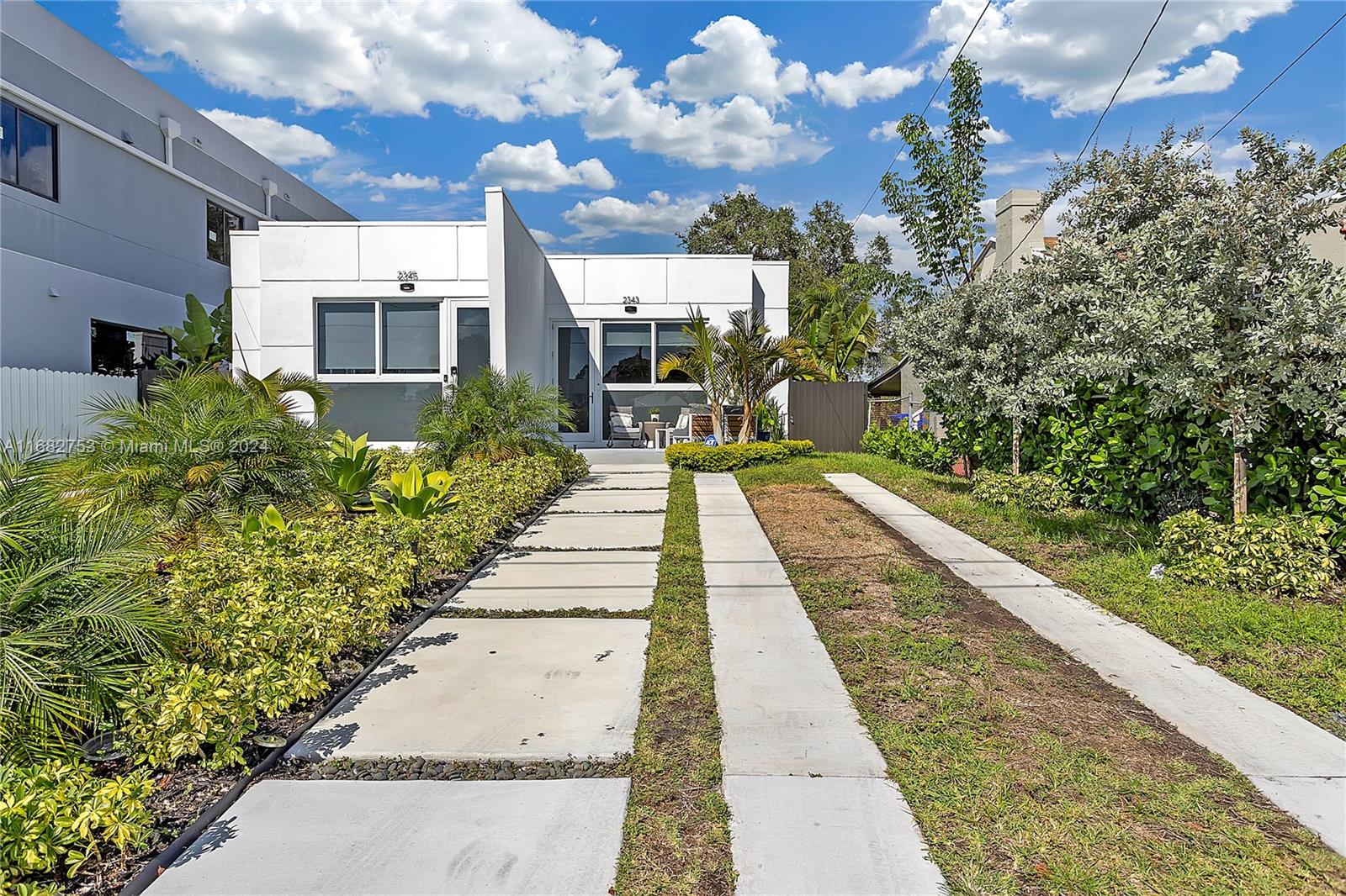 a view of a pathway with a yard