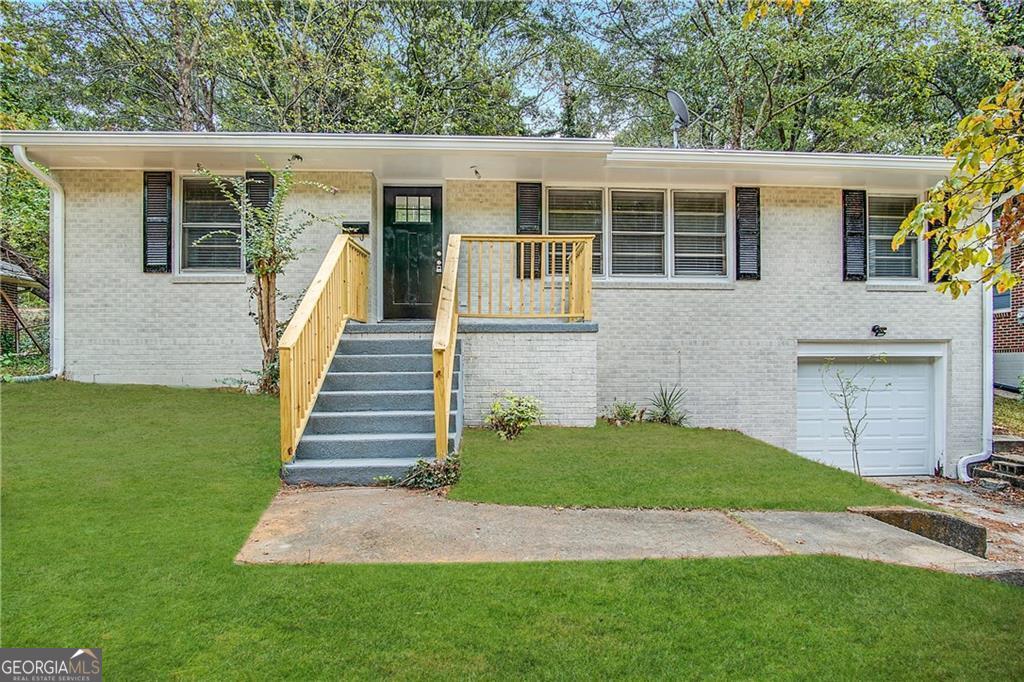 a view of a backyard with stairs plants and large tree