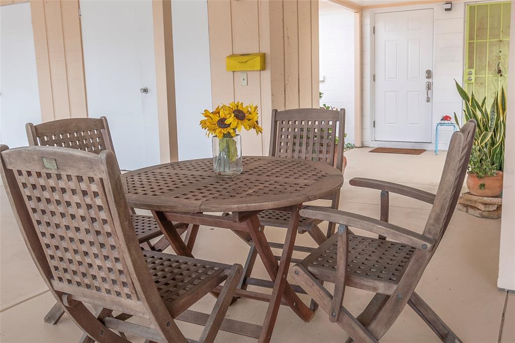 a view of a dining room with furniture and window