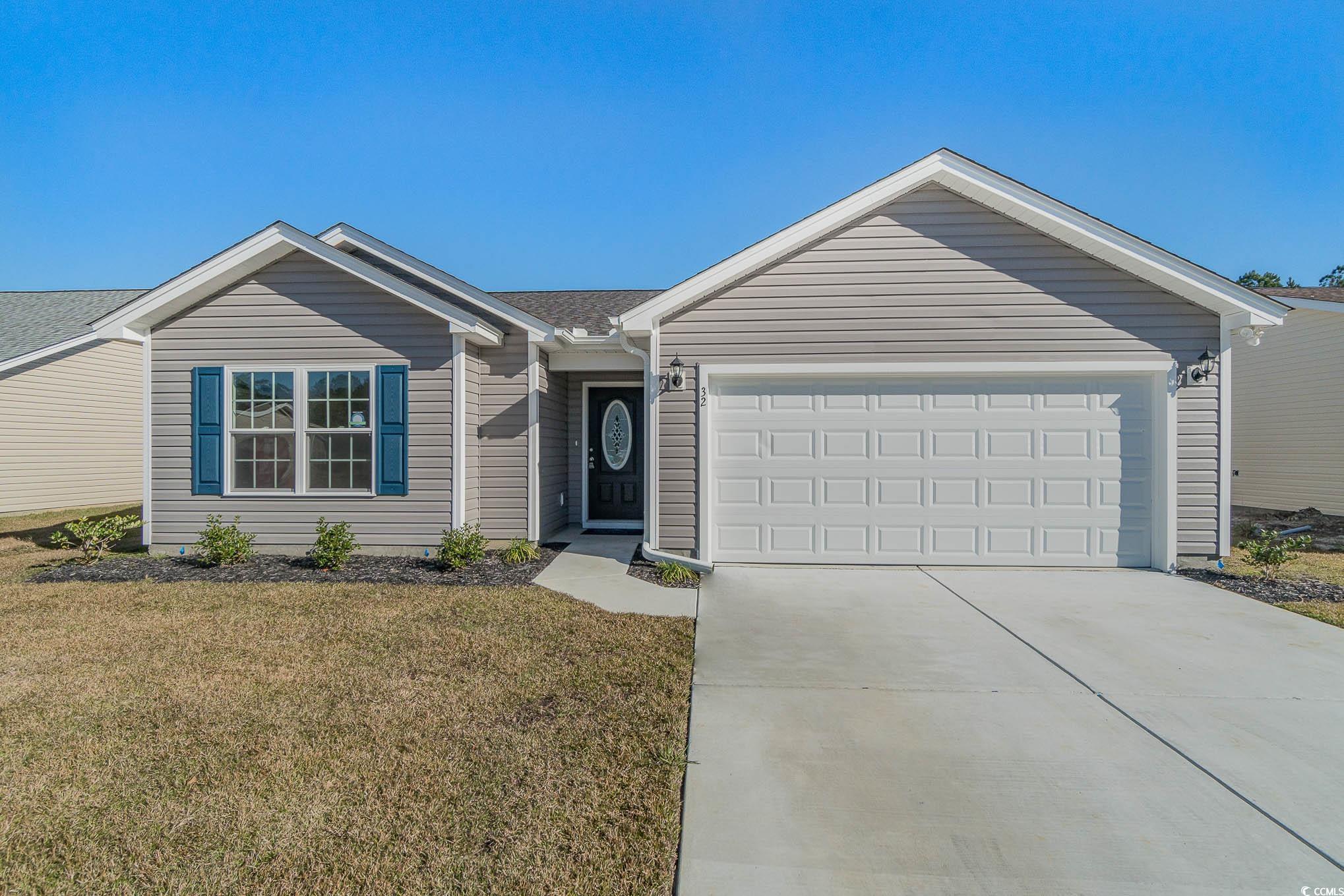 Ranch-style home with a garage and a front yard