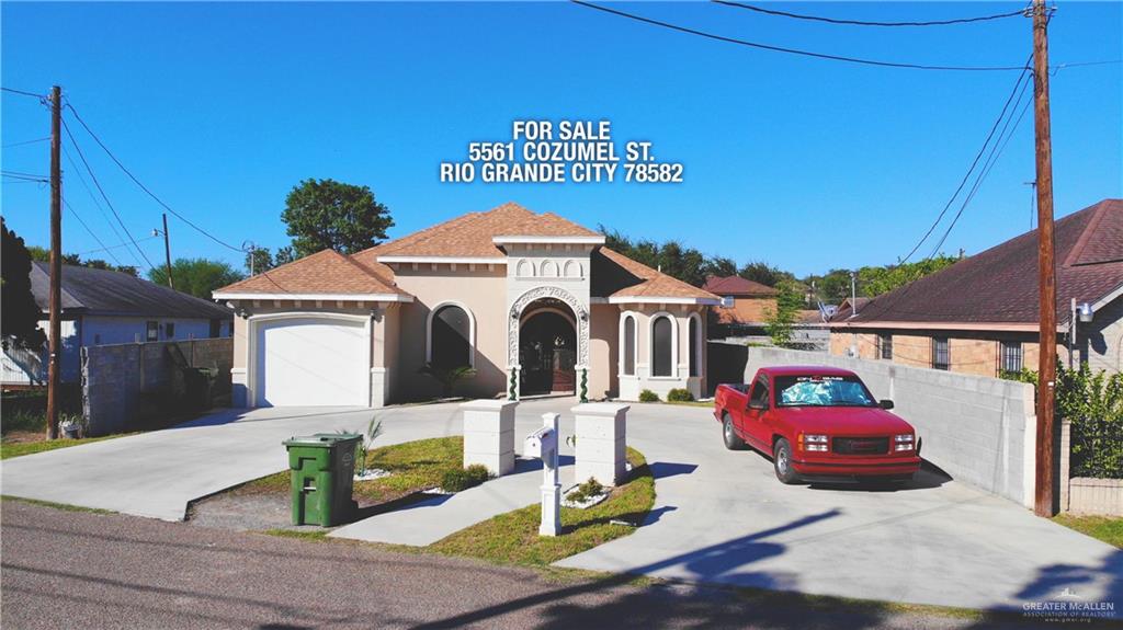 a front view of a house with parking