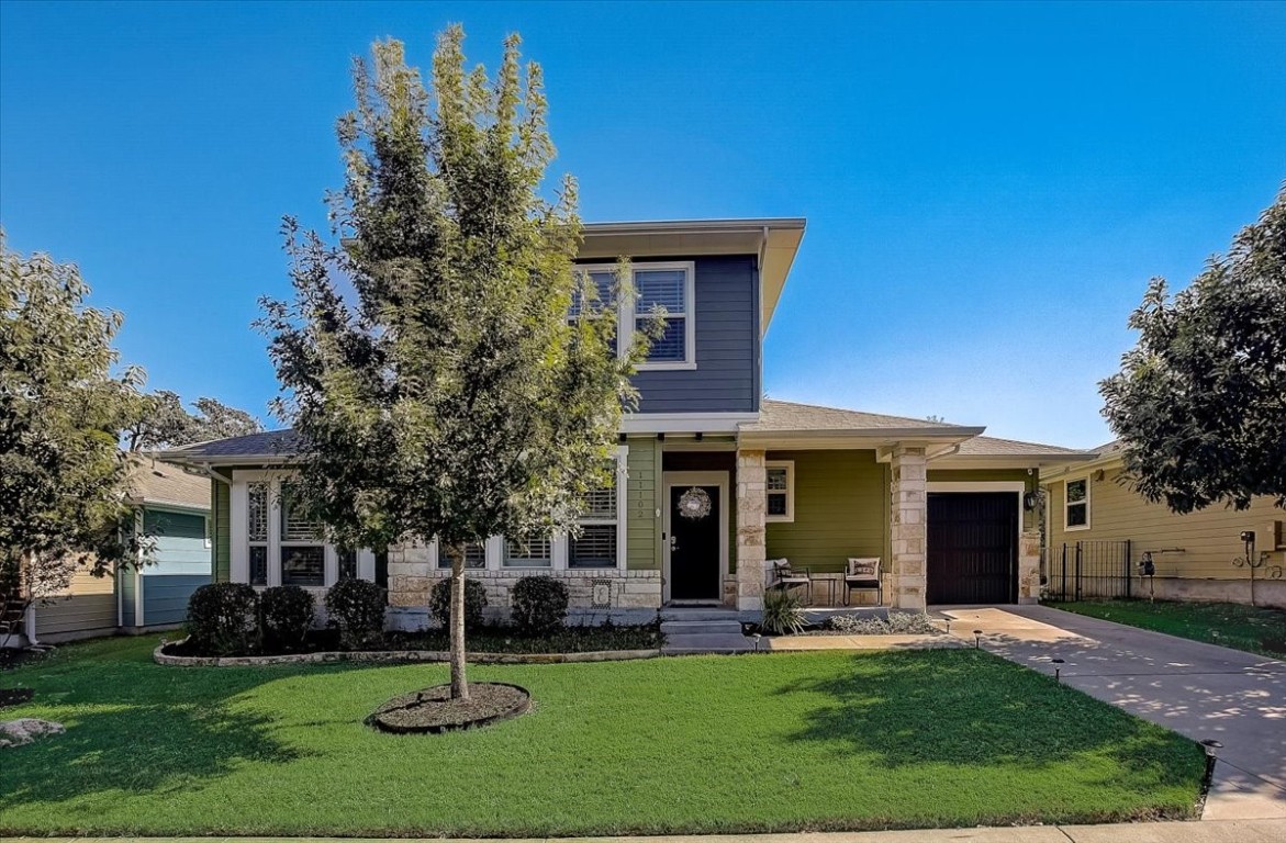 front view of a house with a yard