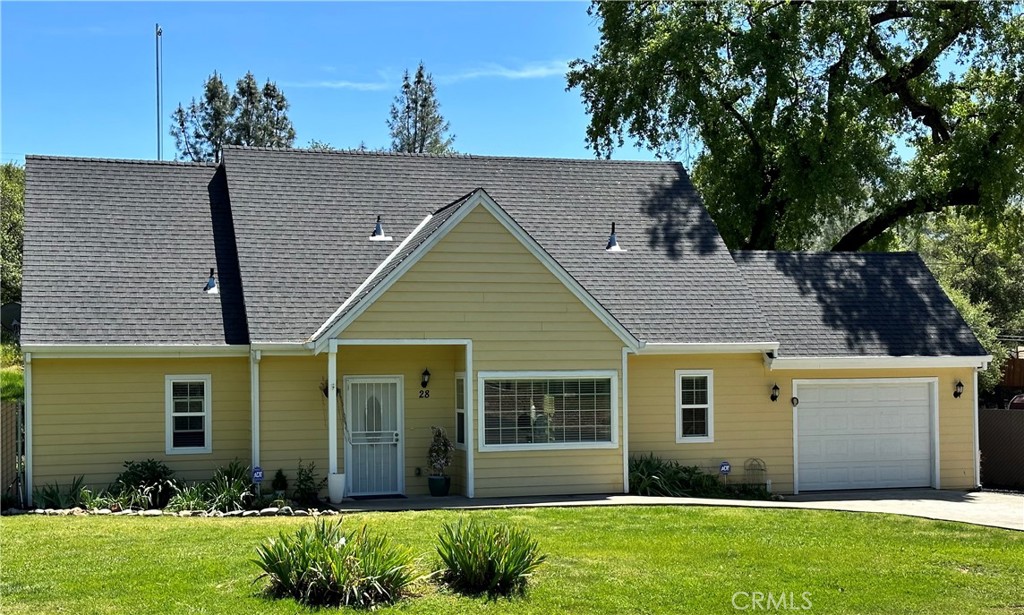 a view of a house with a yard