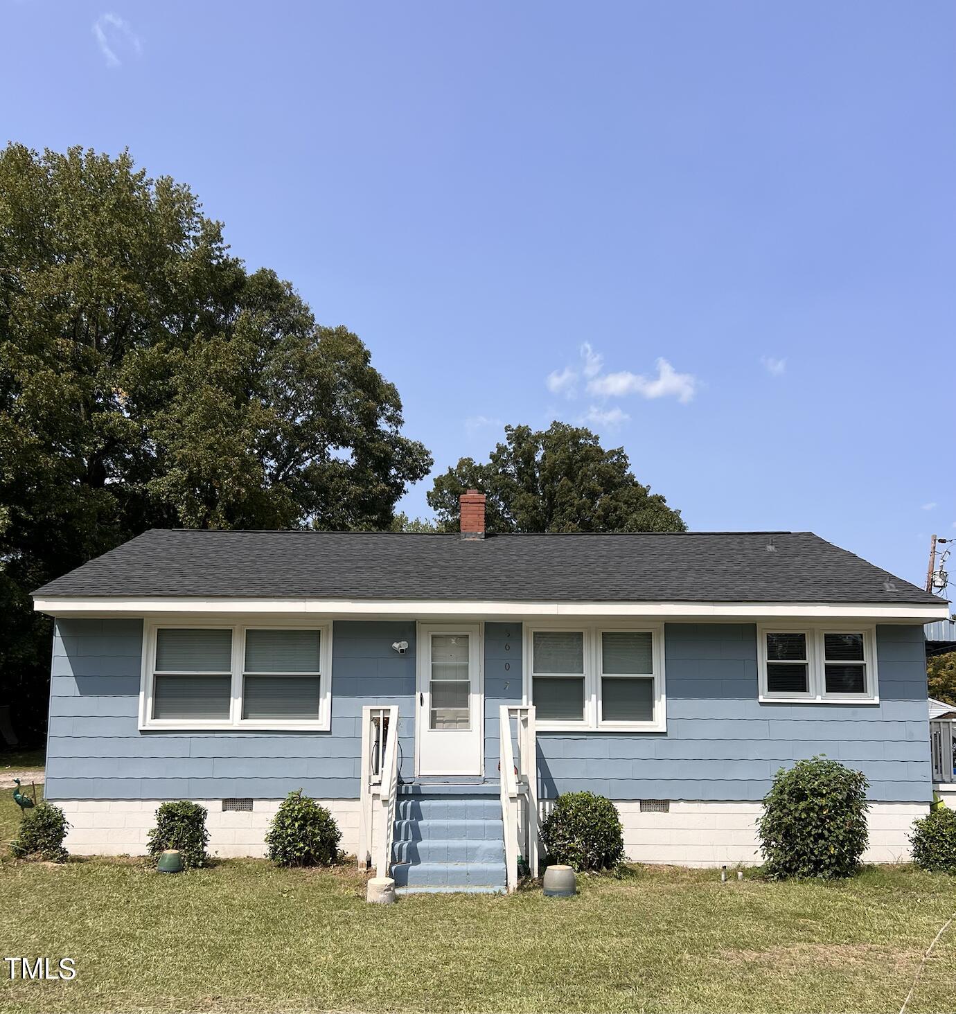 front view of a house with a yard