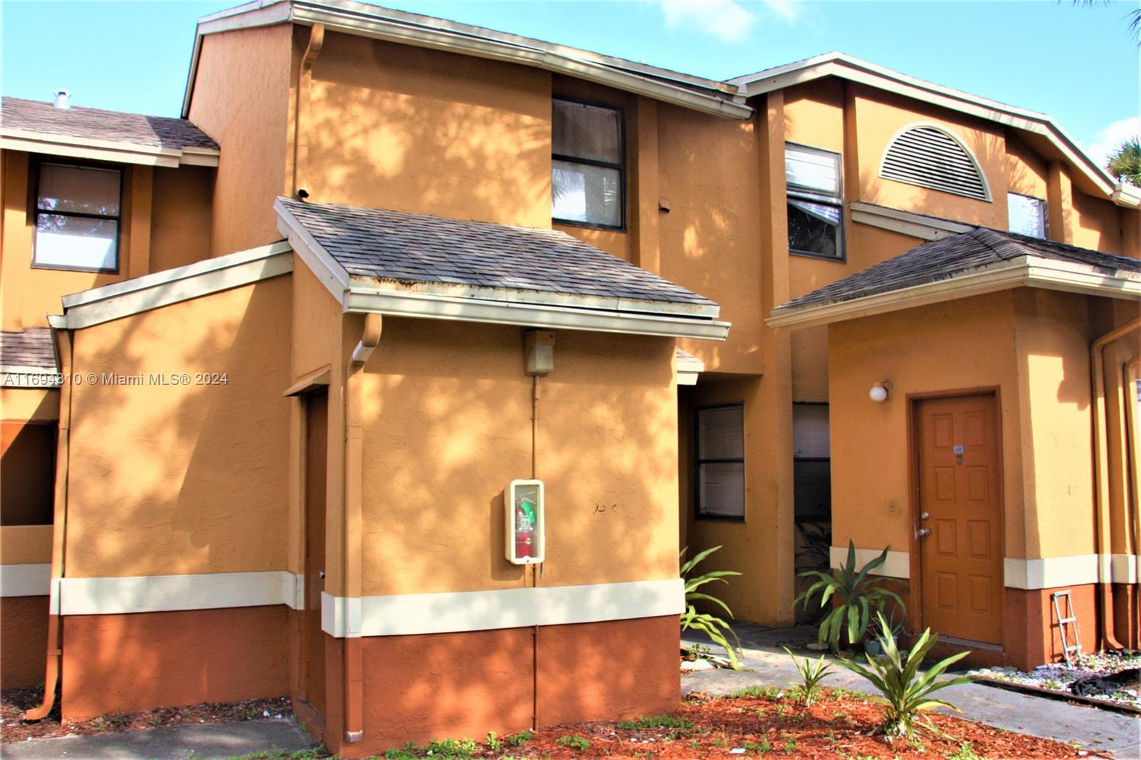 a view of a house with a door and windows