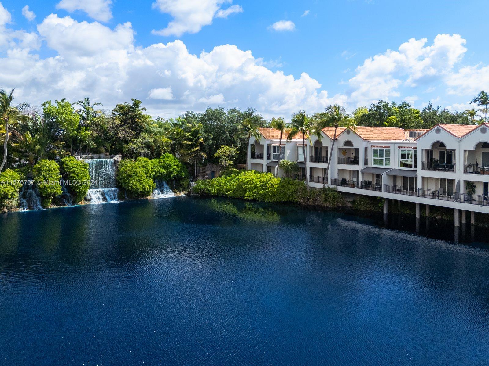 a view of a lake with a house in the background