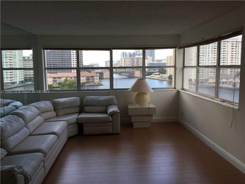 a living room with furniture and a large window