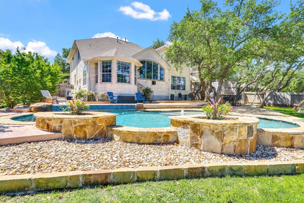 a front view of a house with swimming pool