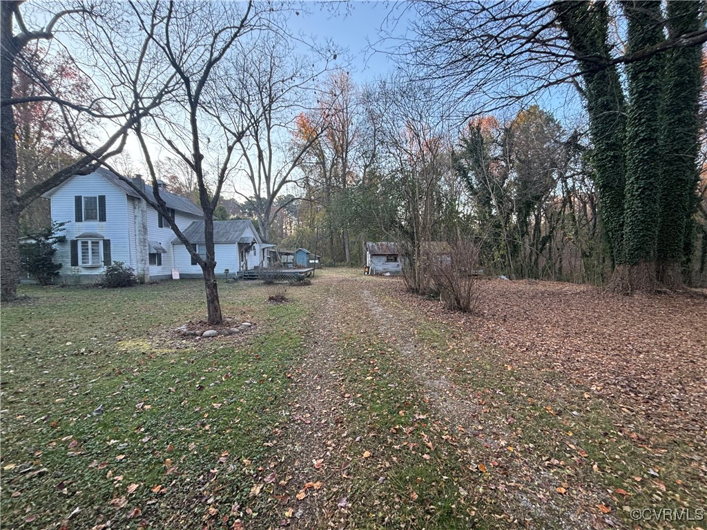 a backyard of a house with lots of green space