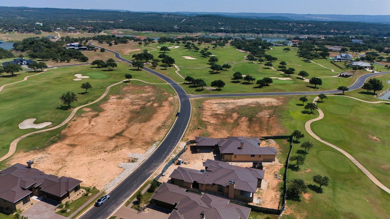 an aerial view of a residential houses with outdoor space