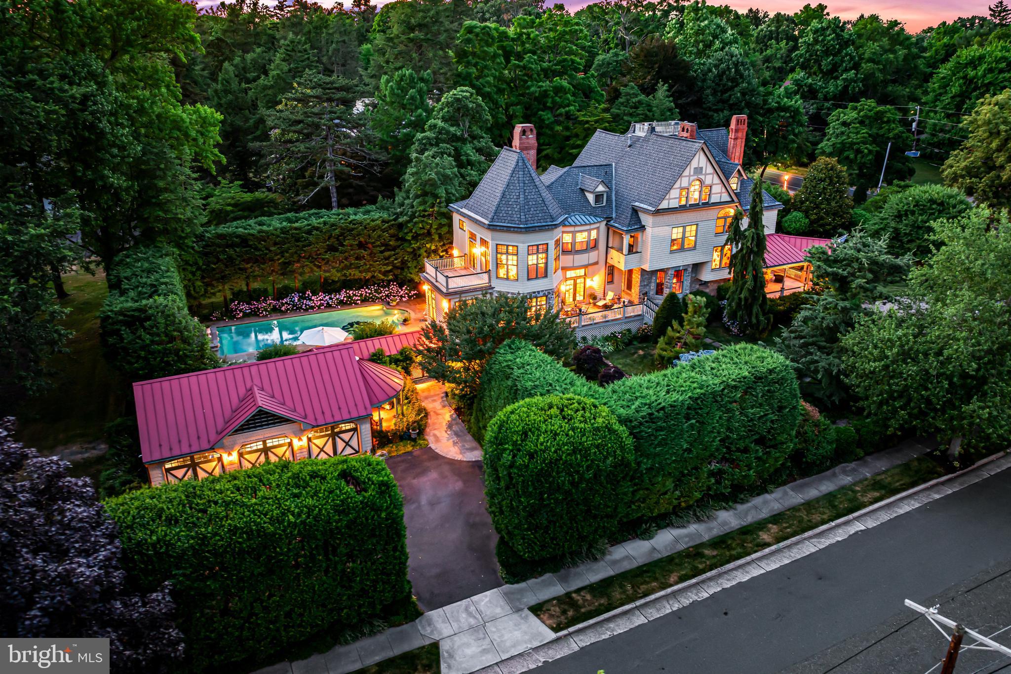 an aerial view of a house with garden space and street view