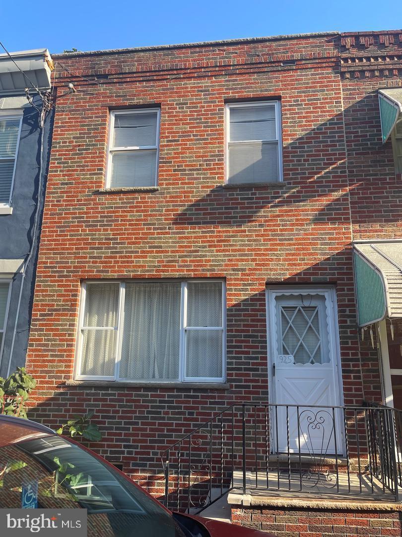 a view of brick building with many windows