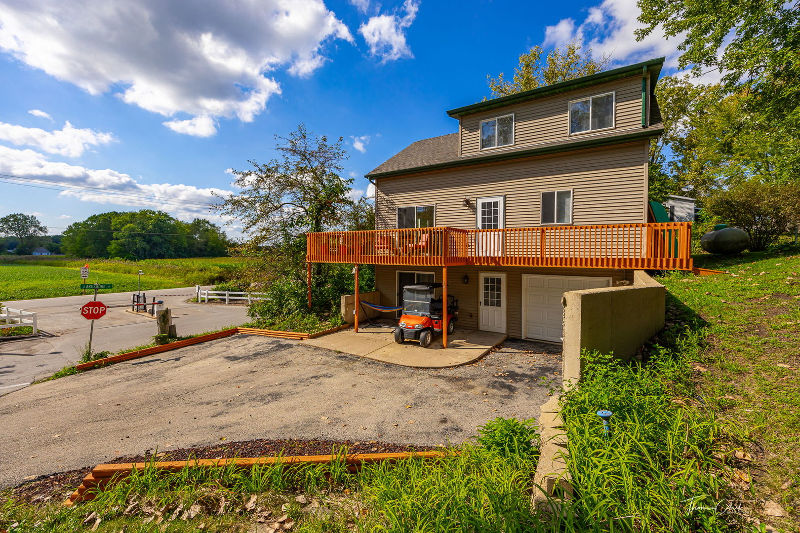 a view of a house with backyard porch and garden