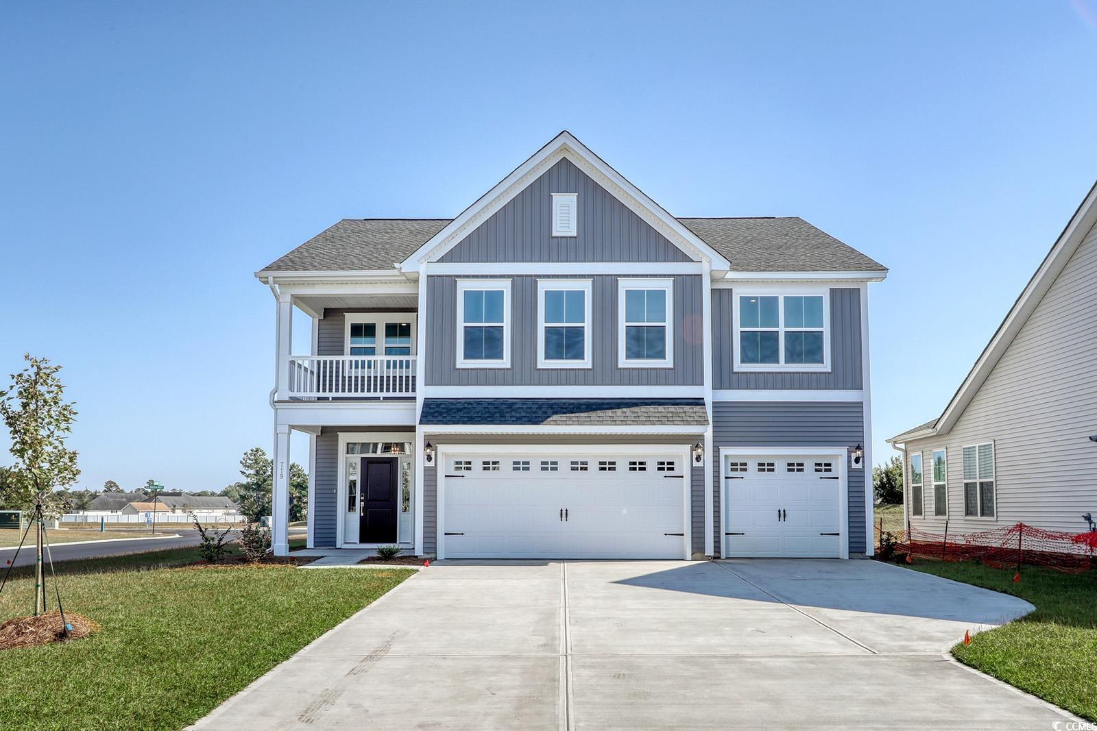 View of front of home featuring a garage and a fro