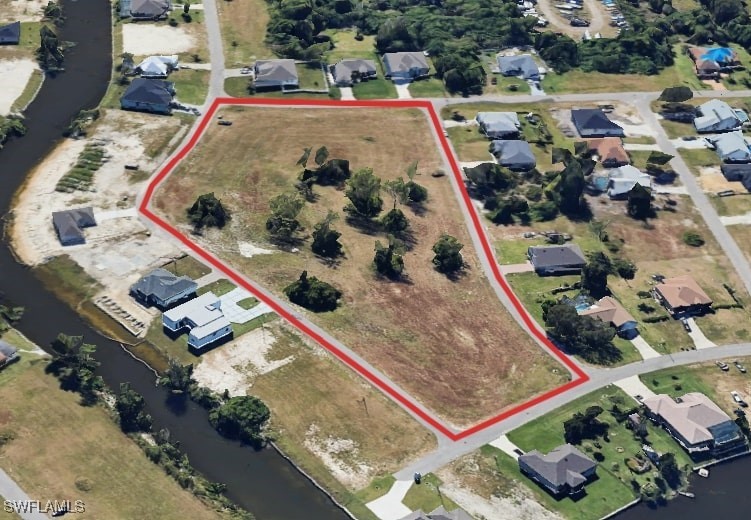 an aerial view of a residential houses with outdoor space