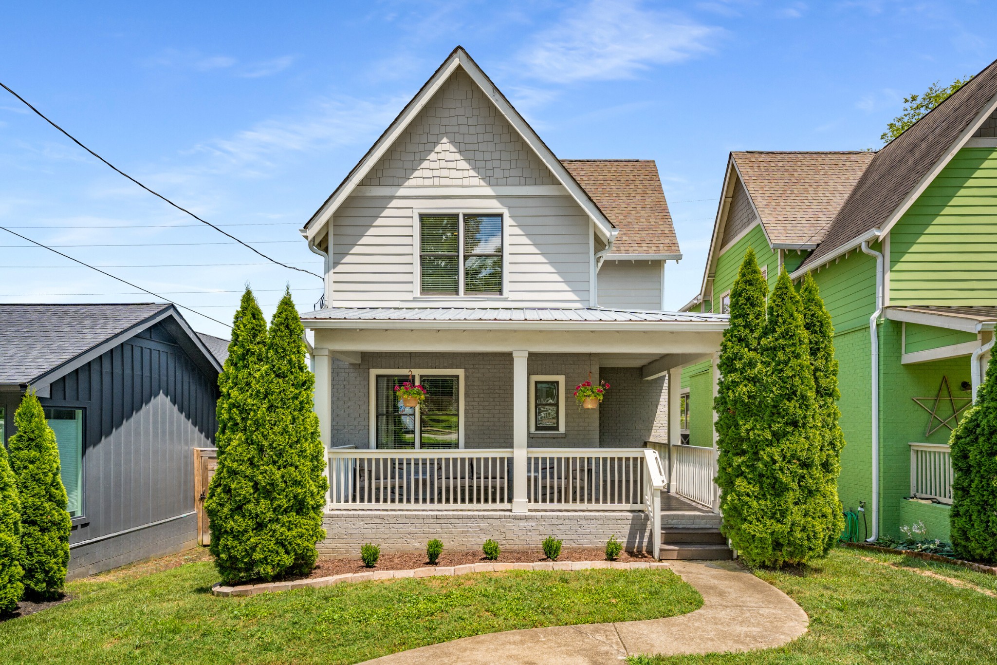 a front view of a house with garden