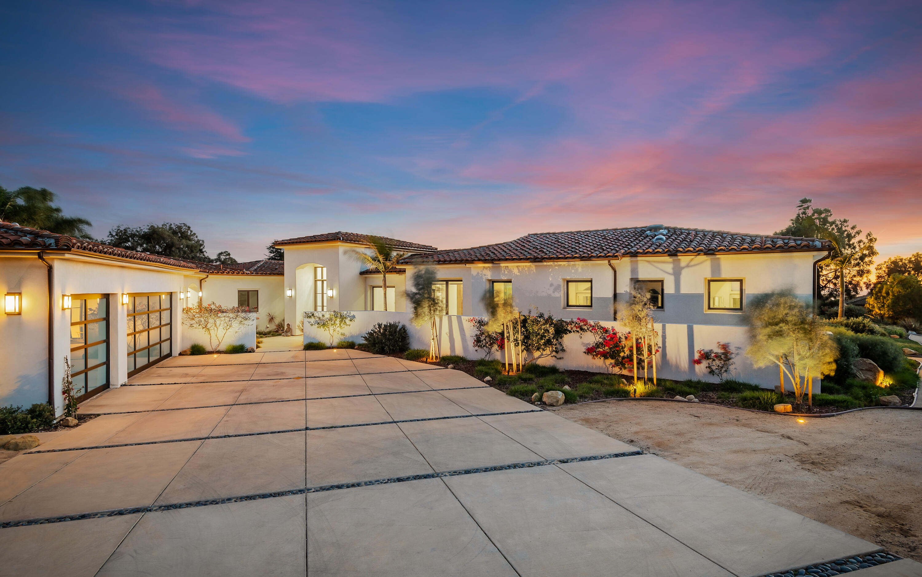 a front view of a house with outdoor seating