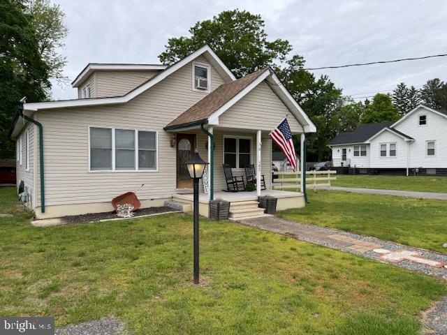 a front view of house with yard and porch