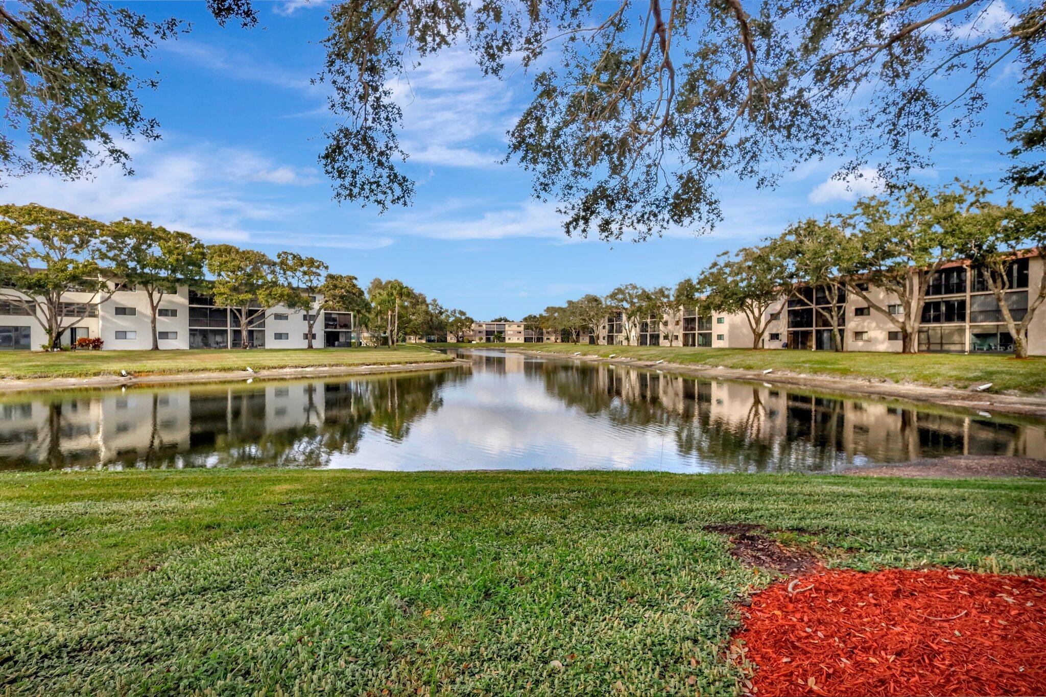 a view of a lake with a yard