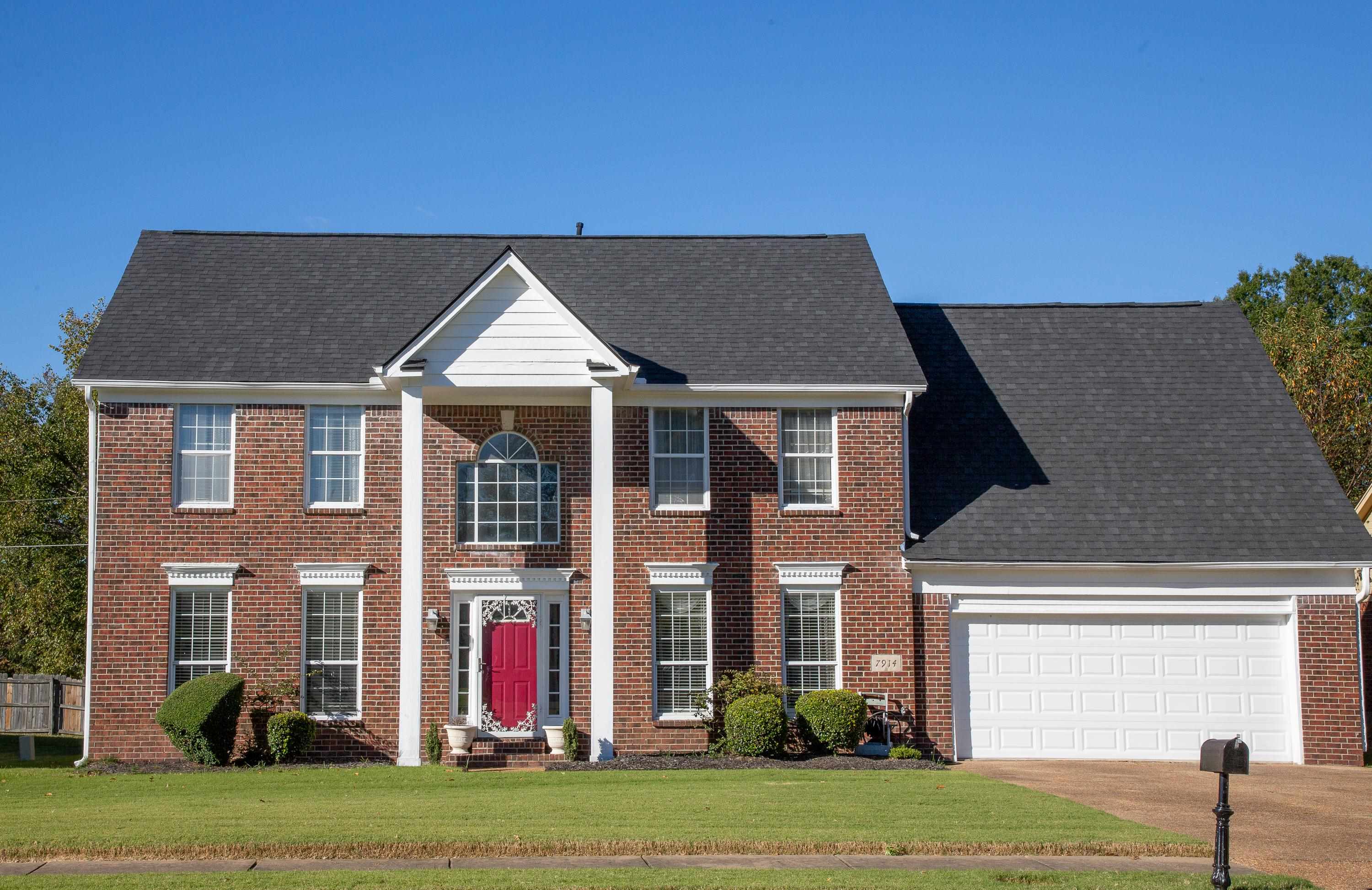 a front view of a house with a yard