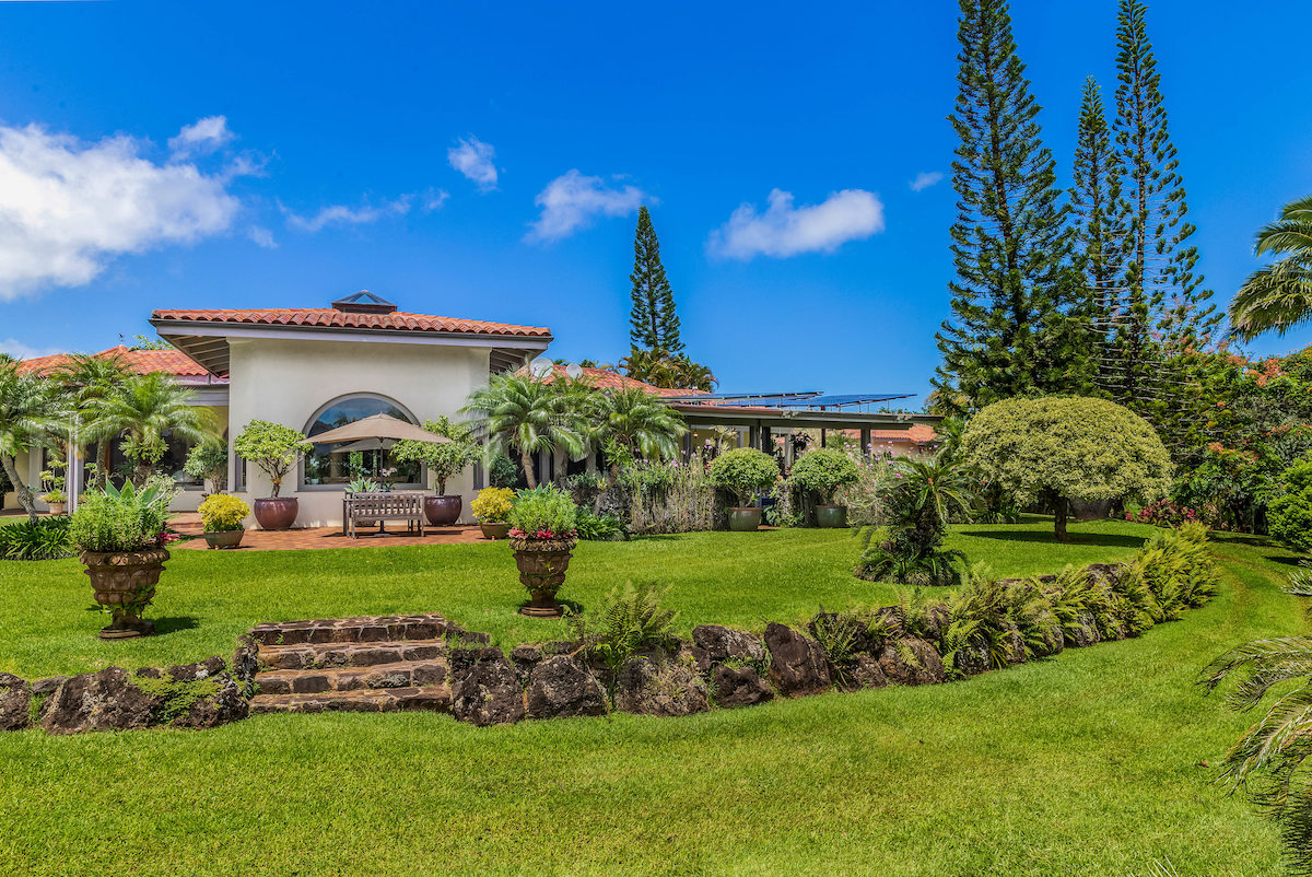 a view of a big yard in front of a house