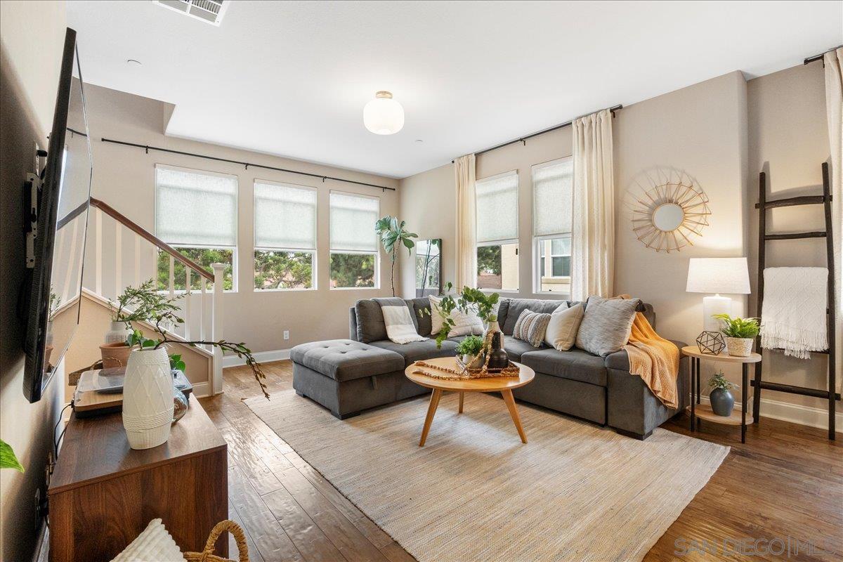 a living room with furniture and a large window