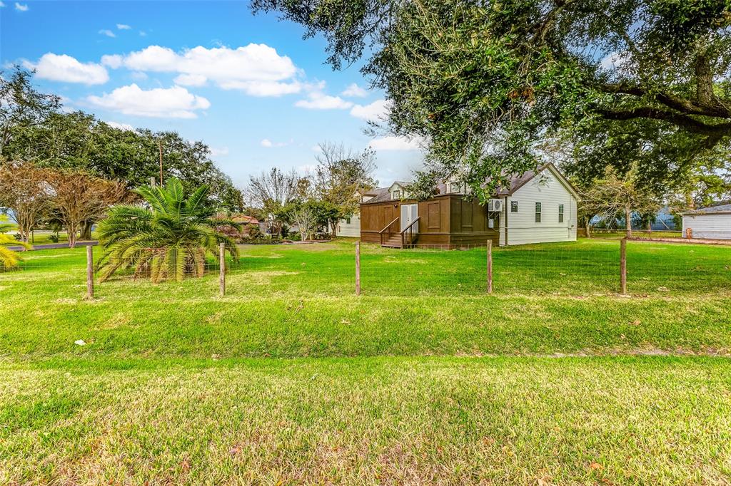 a view of an house with a big yard