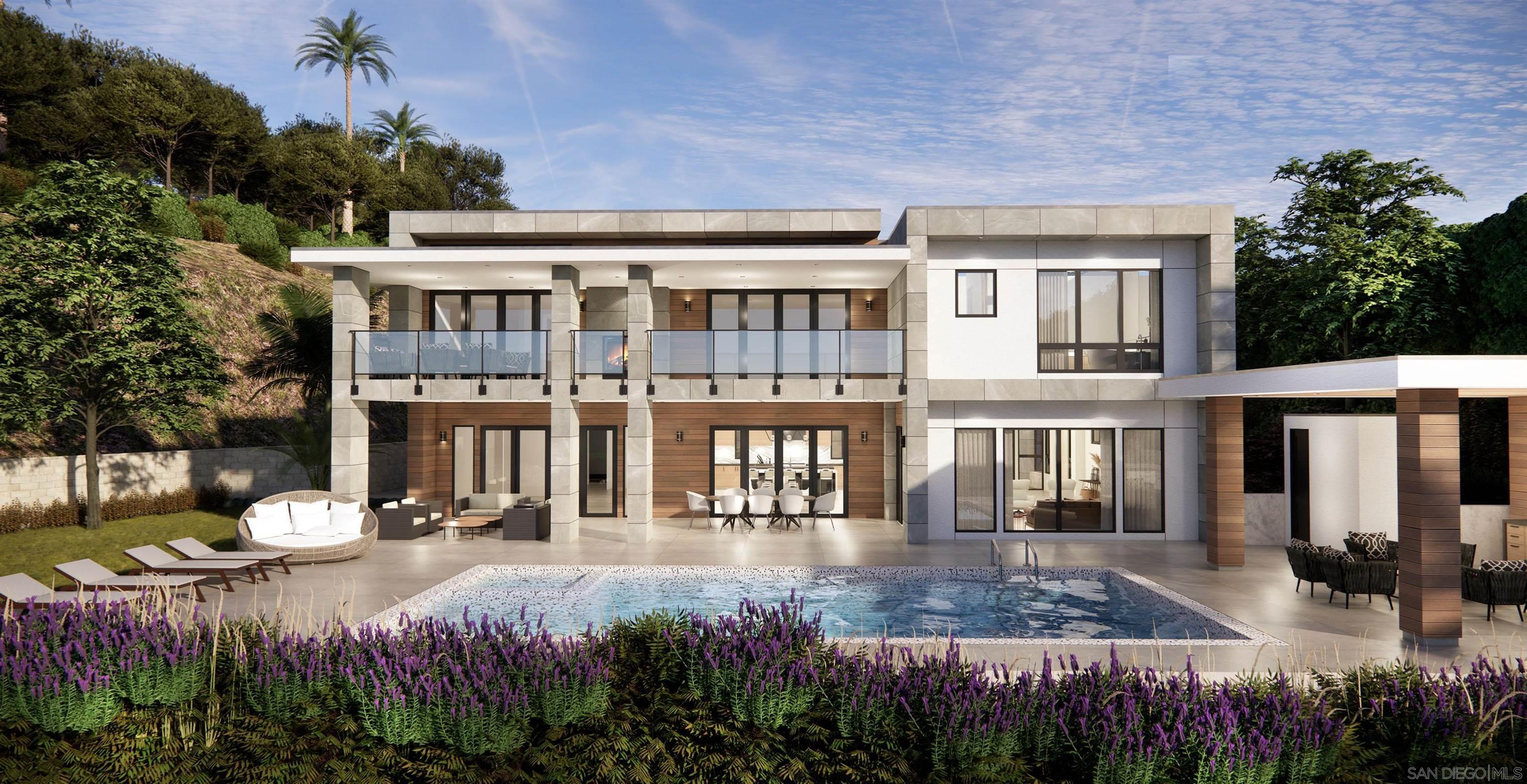 a view of a house with backyard and sitting area