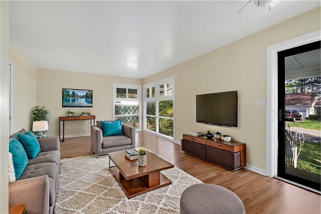 Virtual Staged - Living room featuring light hardwood / wood-style floors