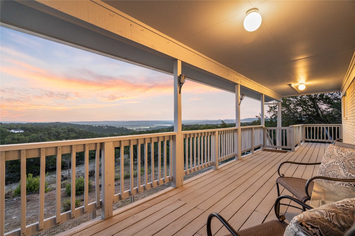 a view of a two chairs in the balcony