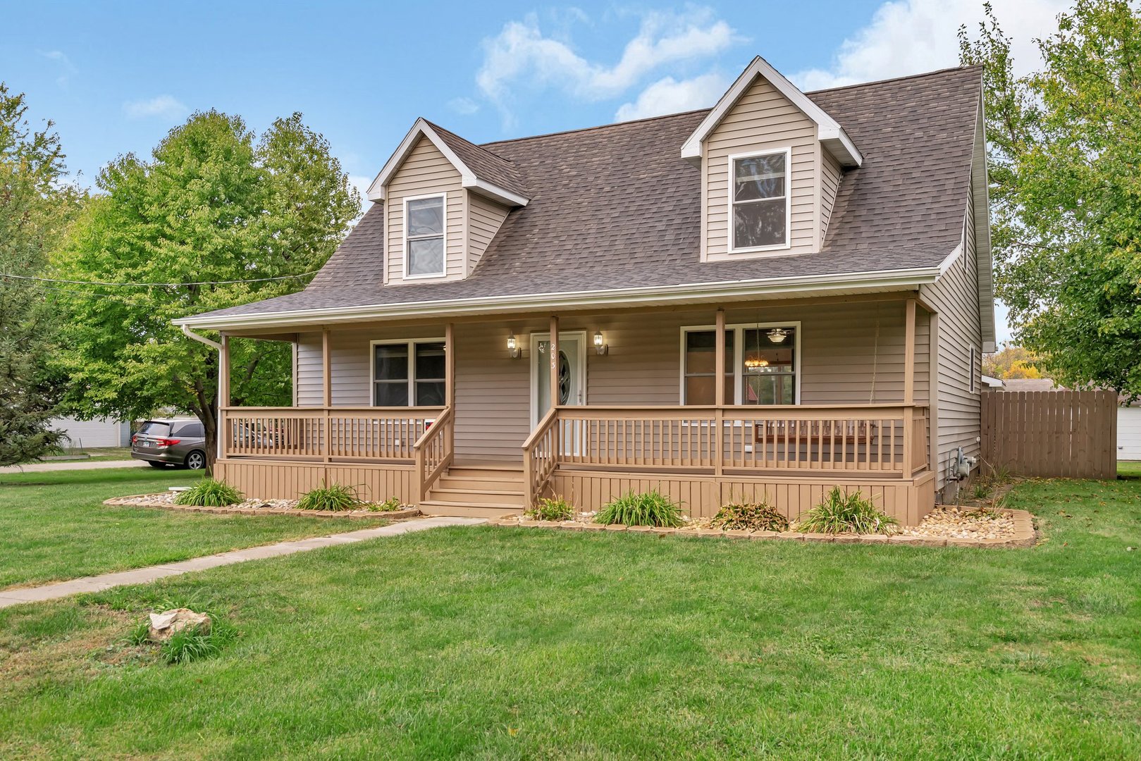 a front view of a house with a yard