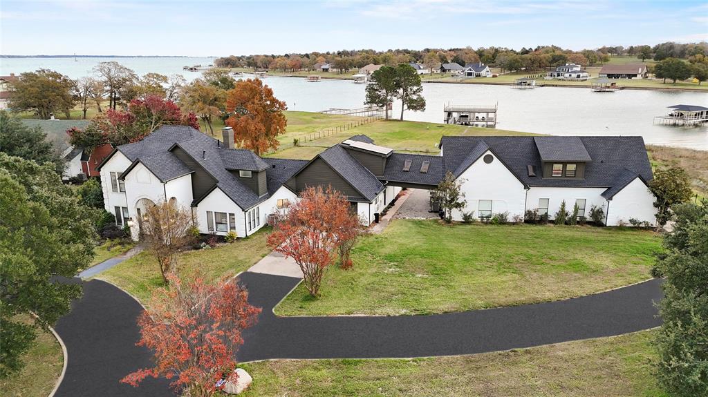 a view of a house with a yard and a large pool