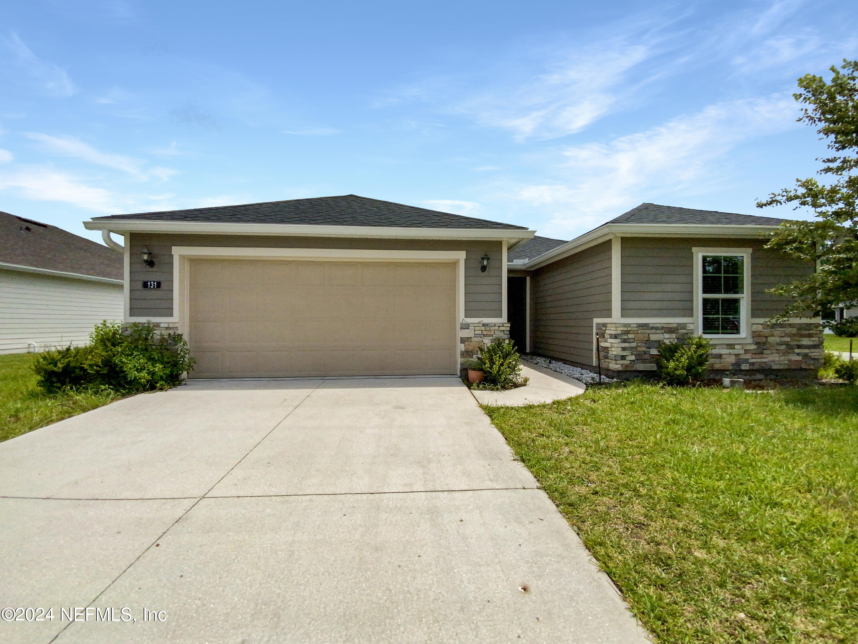 a front view of house with yard