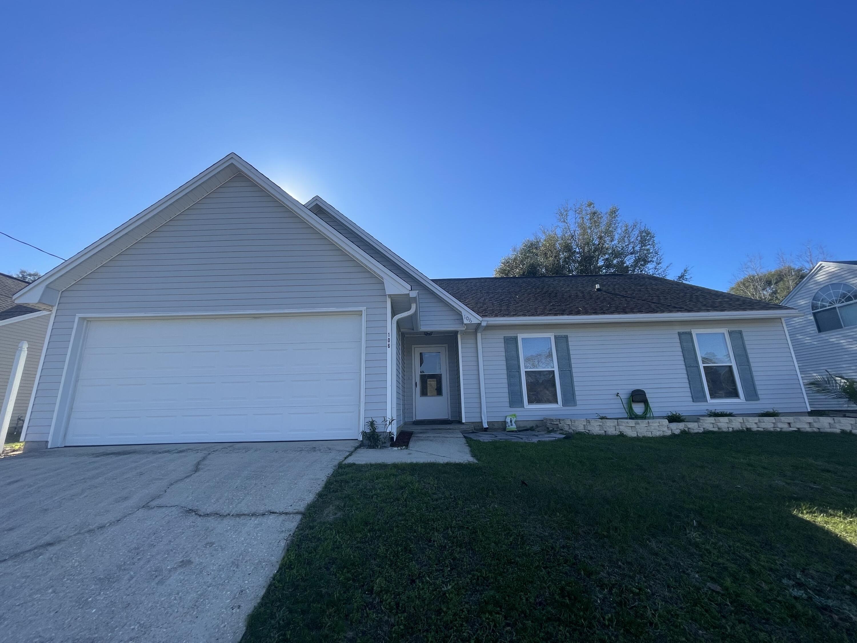 a view of house with yard