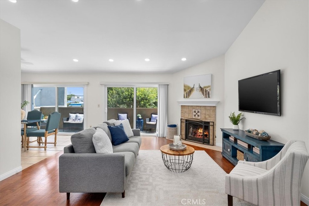 a living room with furniture fireplace and a flat screen tv