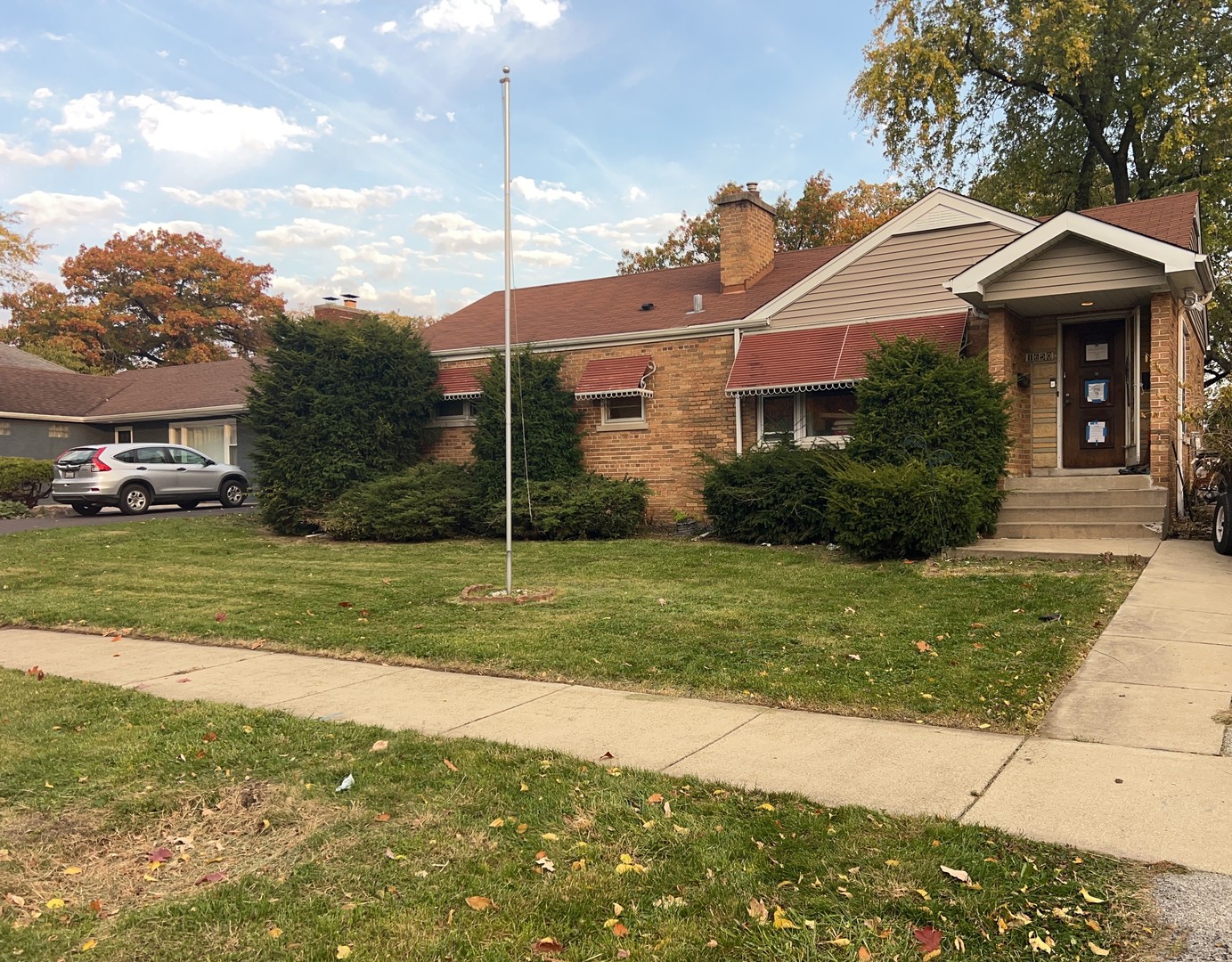 a front view of a house with garden