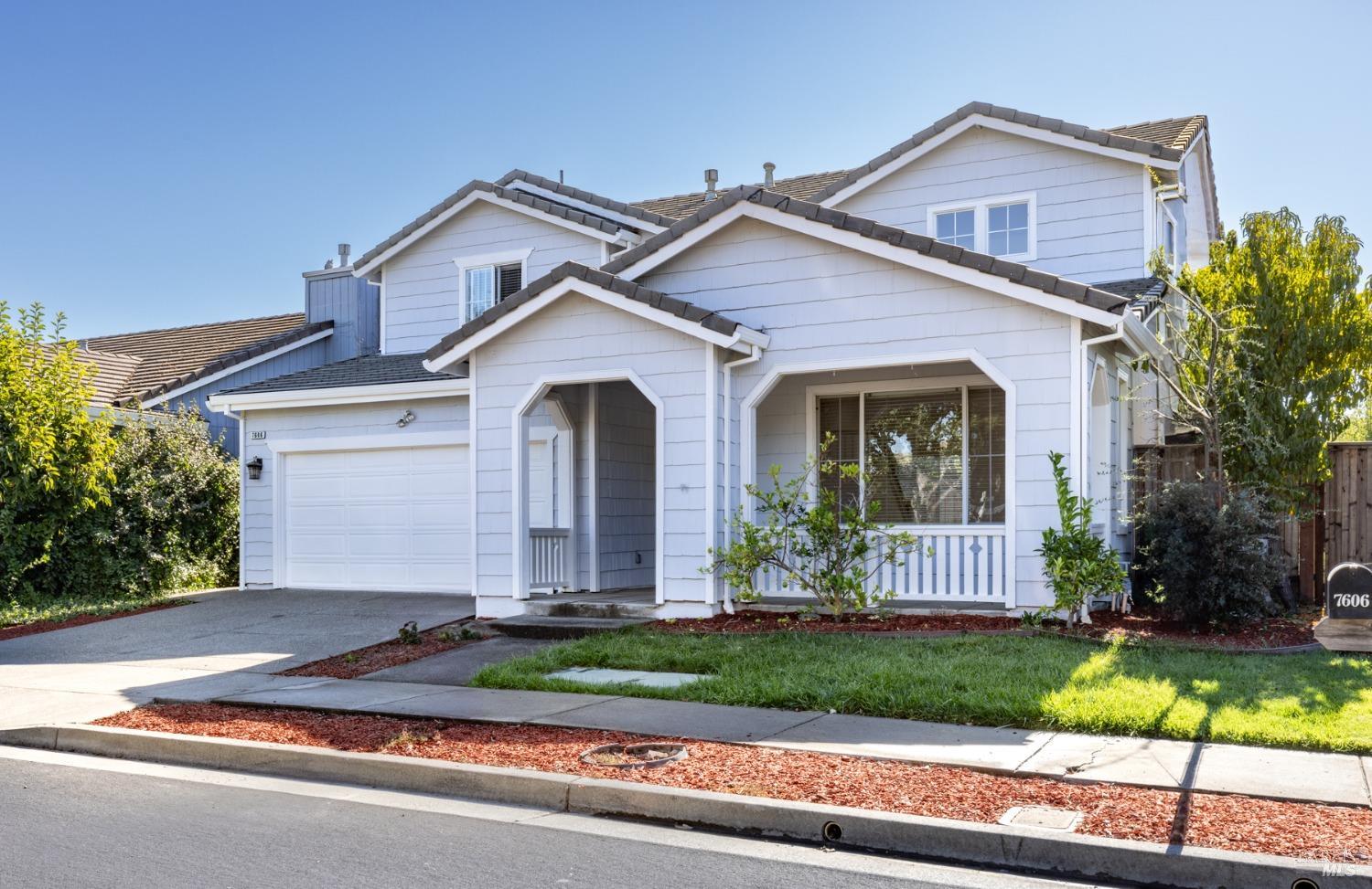 front view of a house with a yard