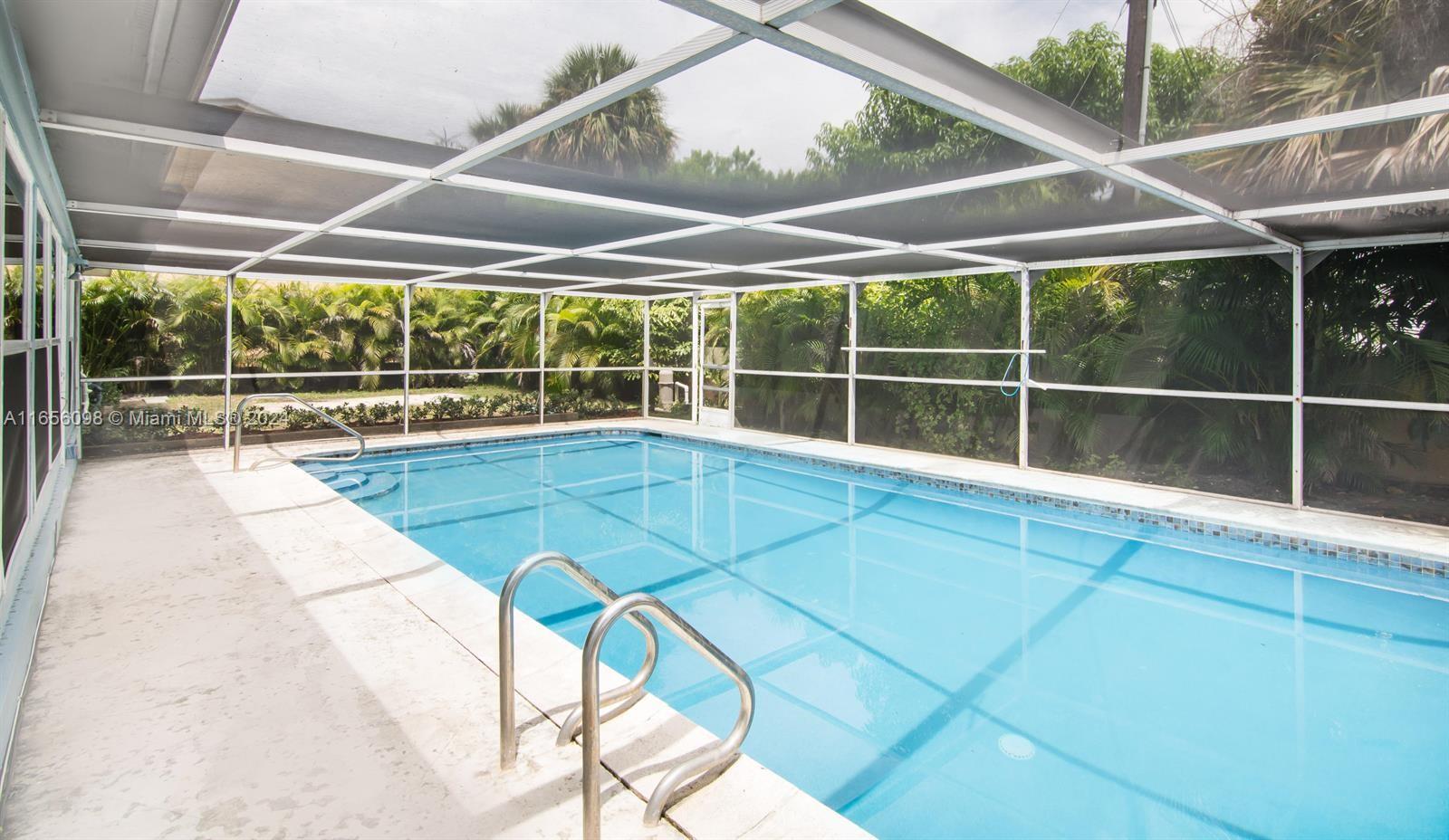 a view of outdoor space with swimming pool