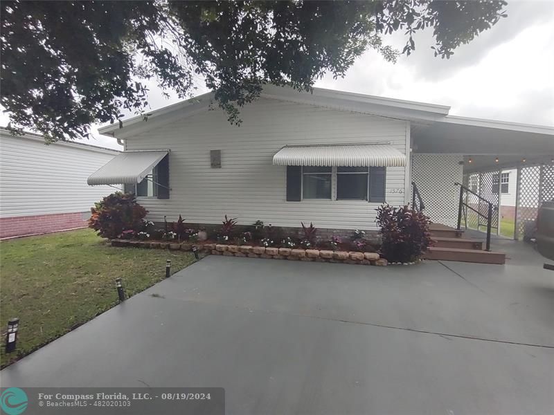 a house view with a garden space