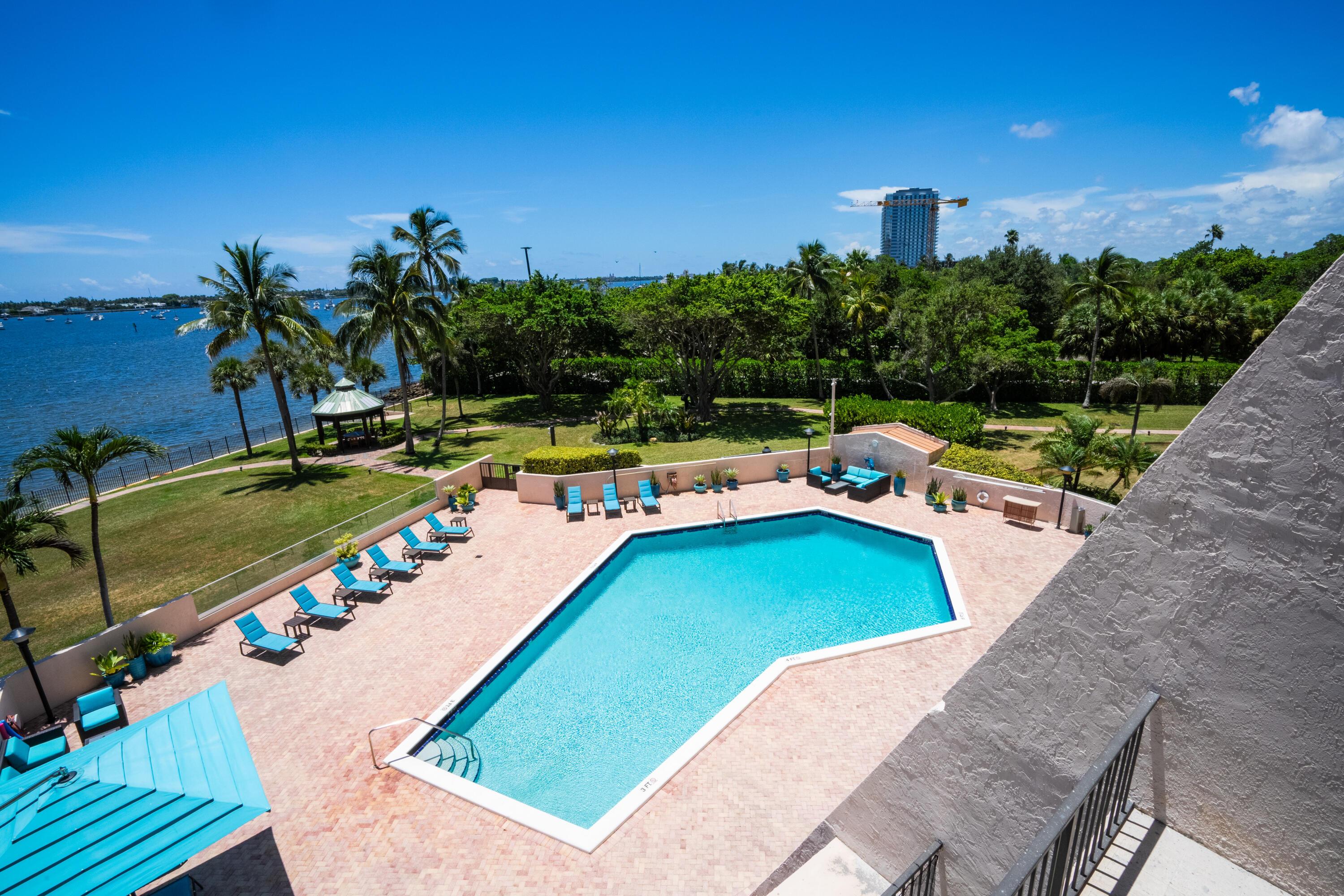 a view of a swimming pool with a yard