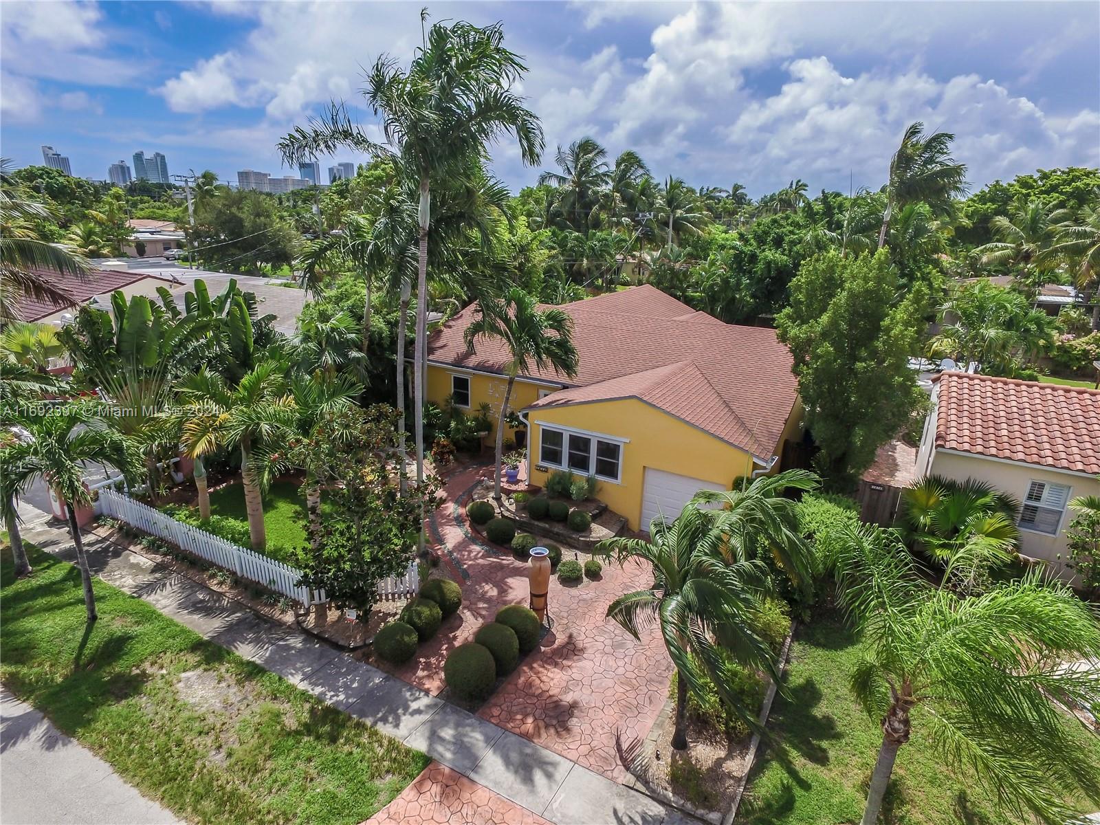 an aerial view of a house with a garden