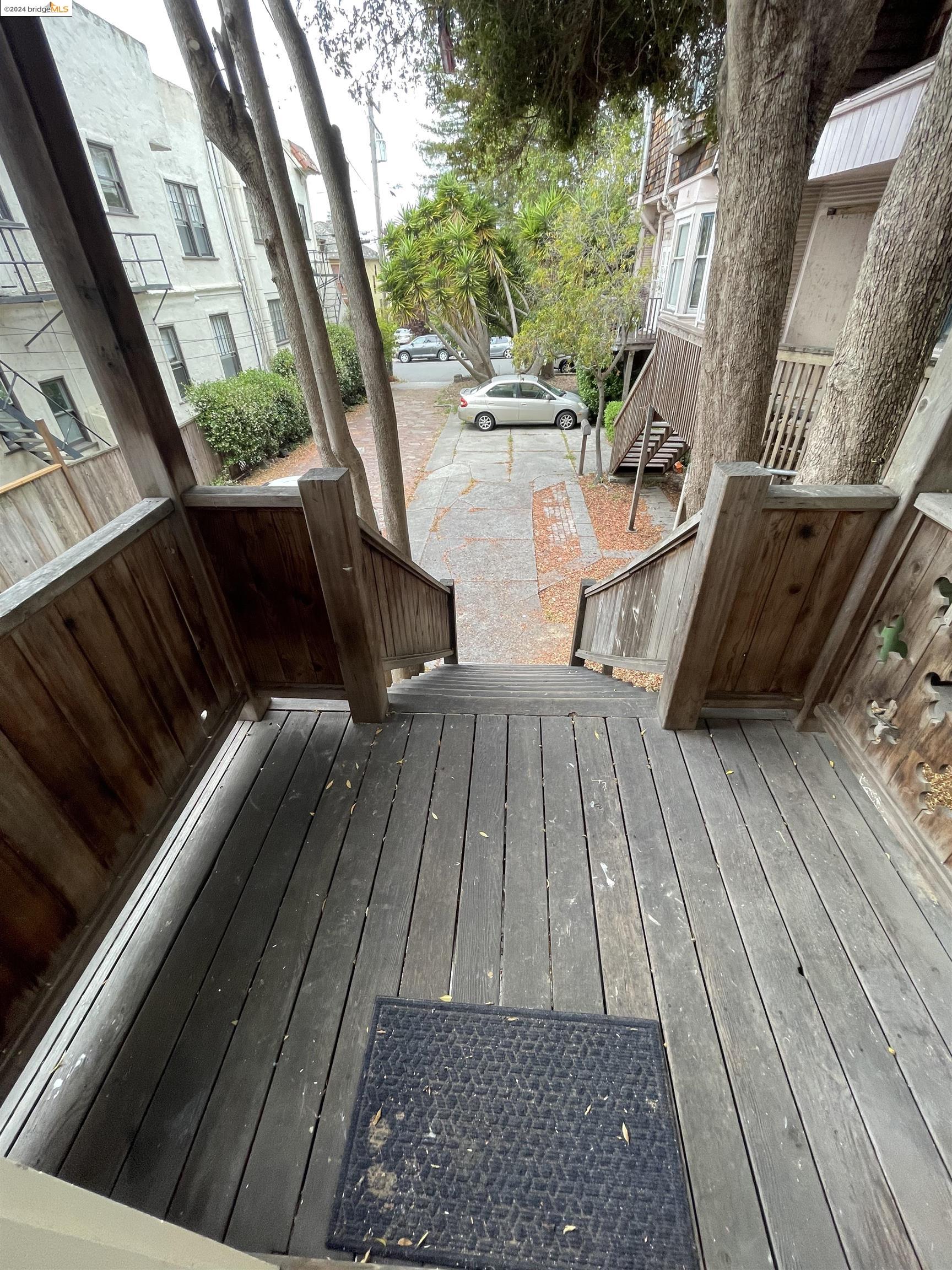 a view of balcony with wooden floor and bench