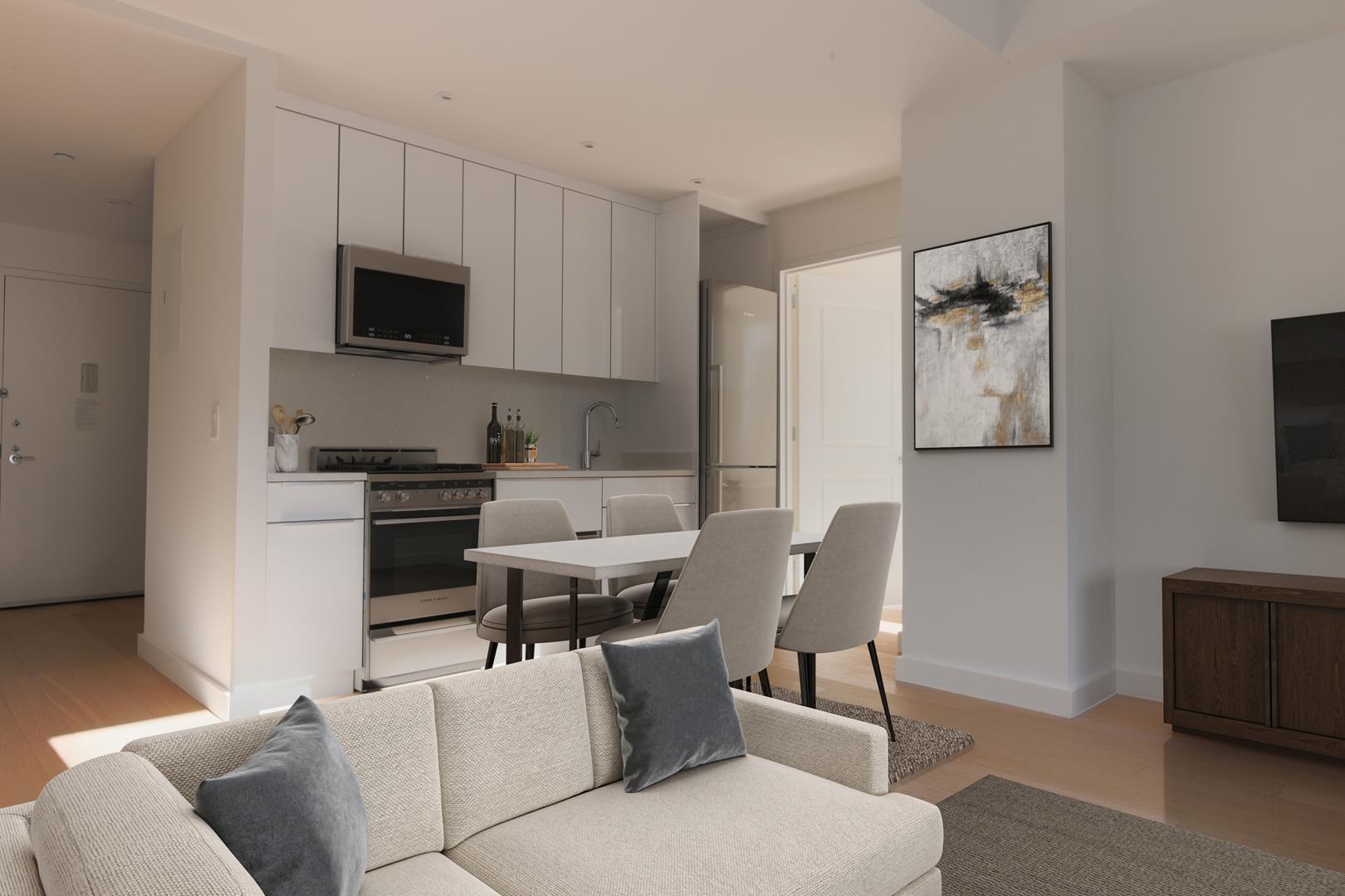 a living room with furniture a flat screen tv and kitchen view