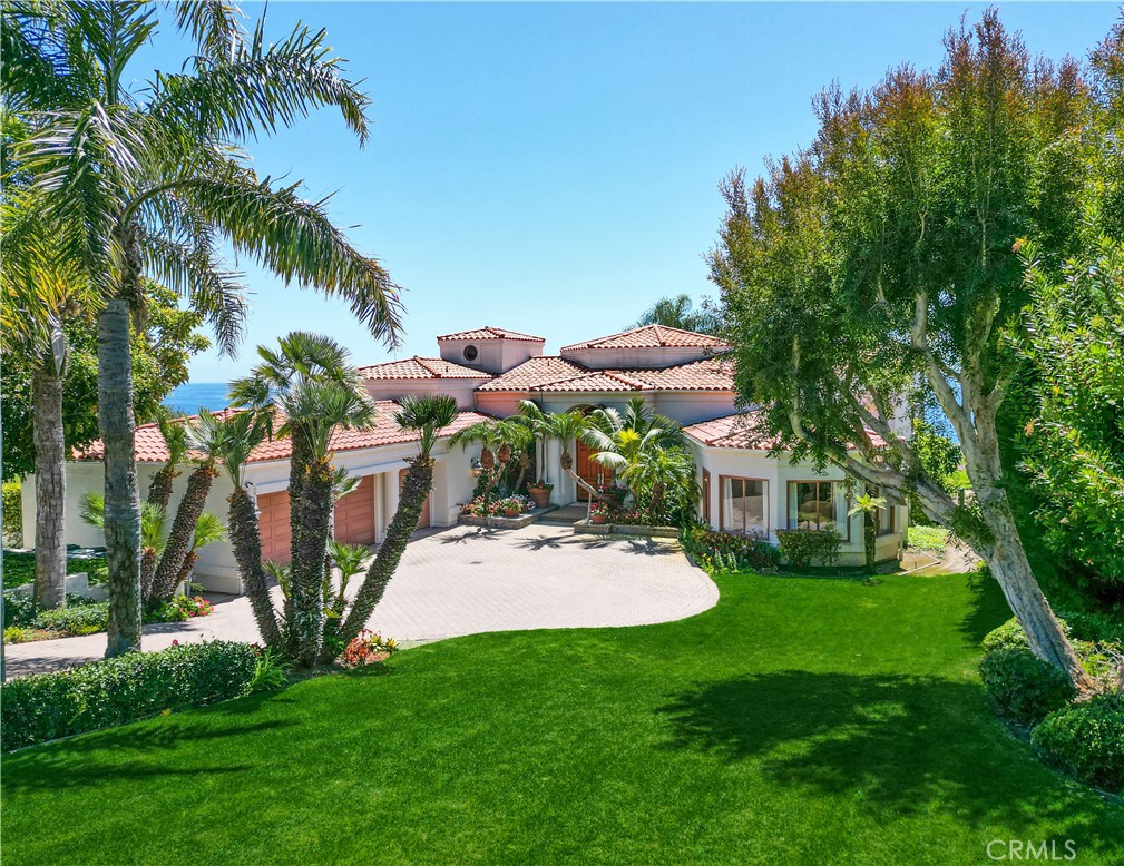 a view of a house with backyard porch and sitting area