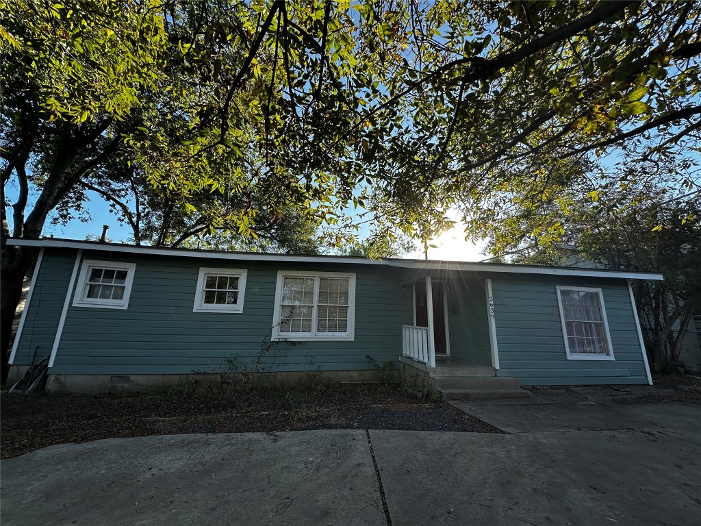 a house with trees in the background