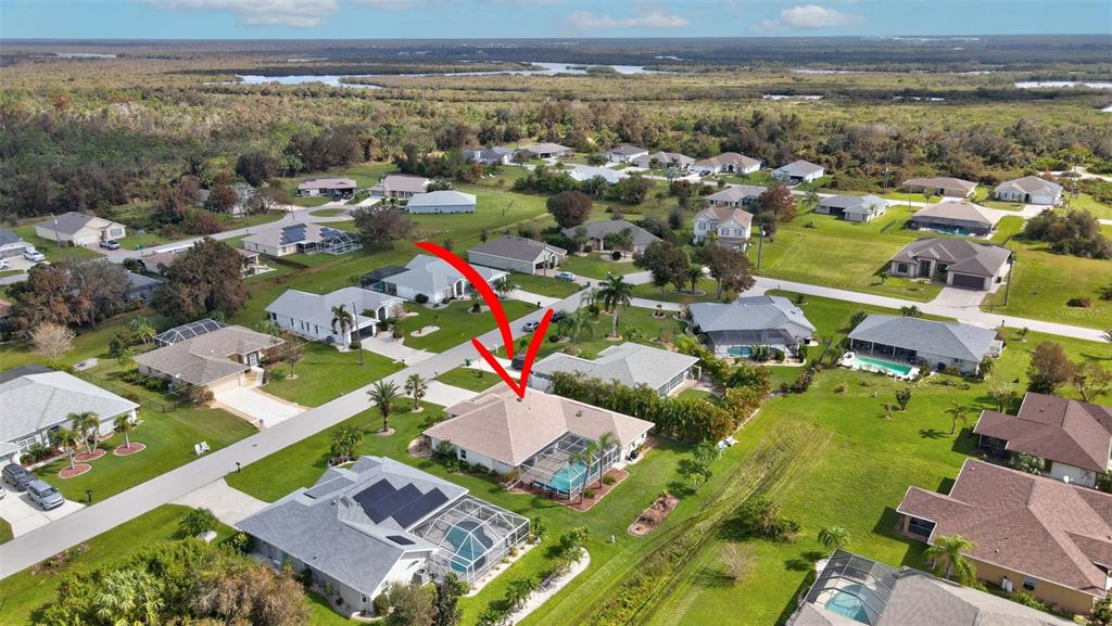 an aerial view of residential houses with outdoor space