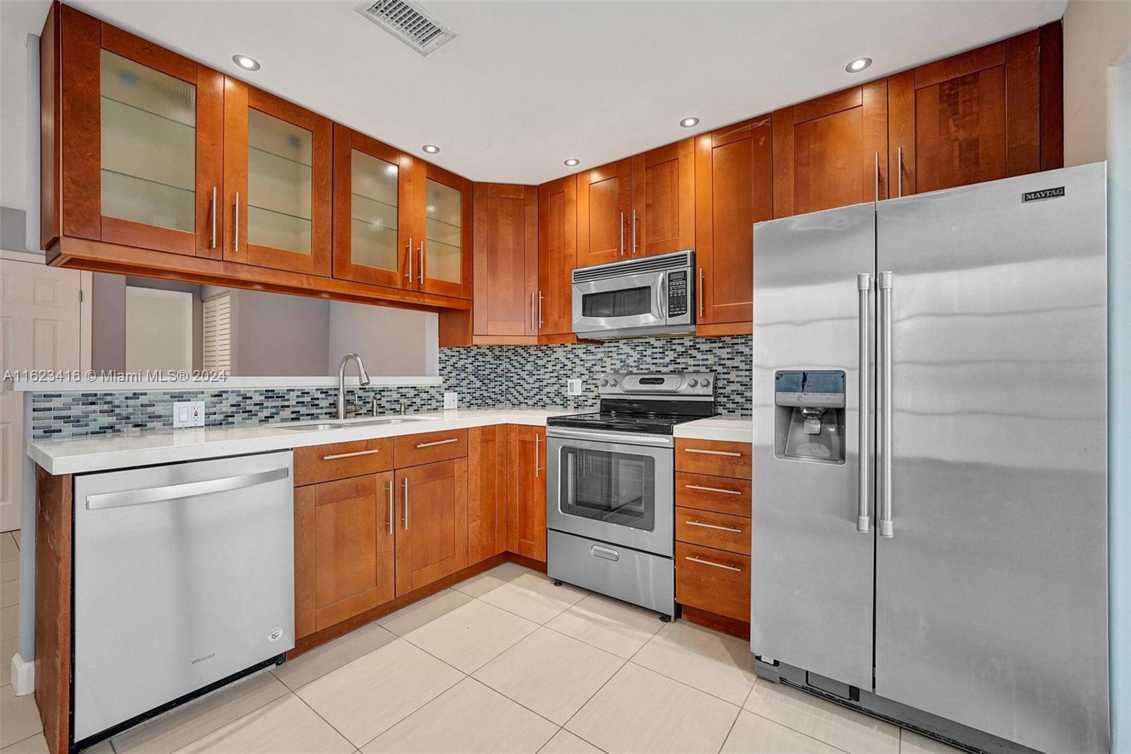 Gorgeous kitchen has pass-through to dining room.