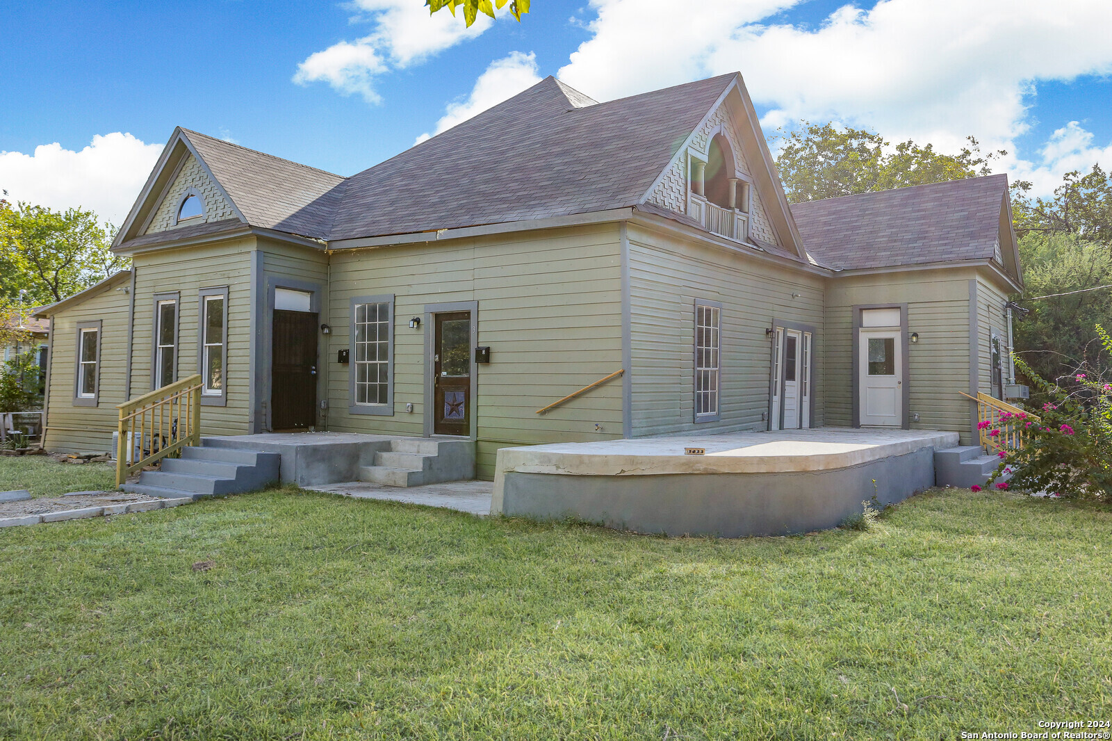 a front view of house with yard and seating area